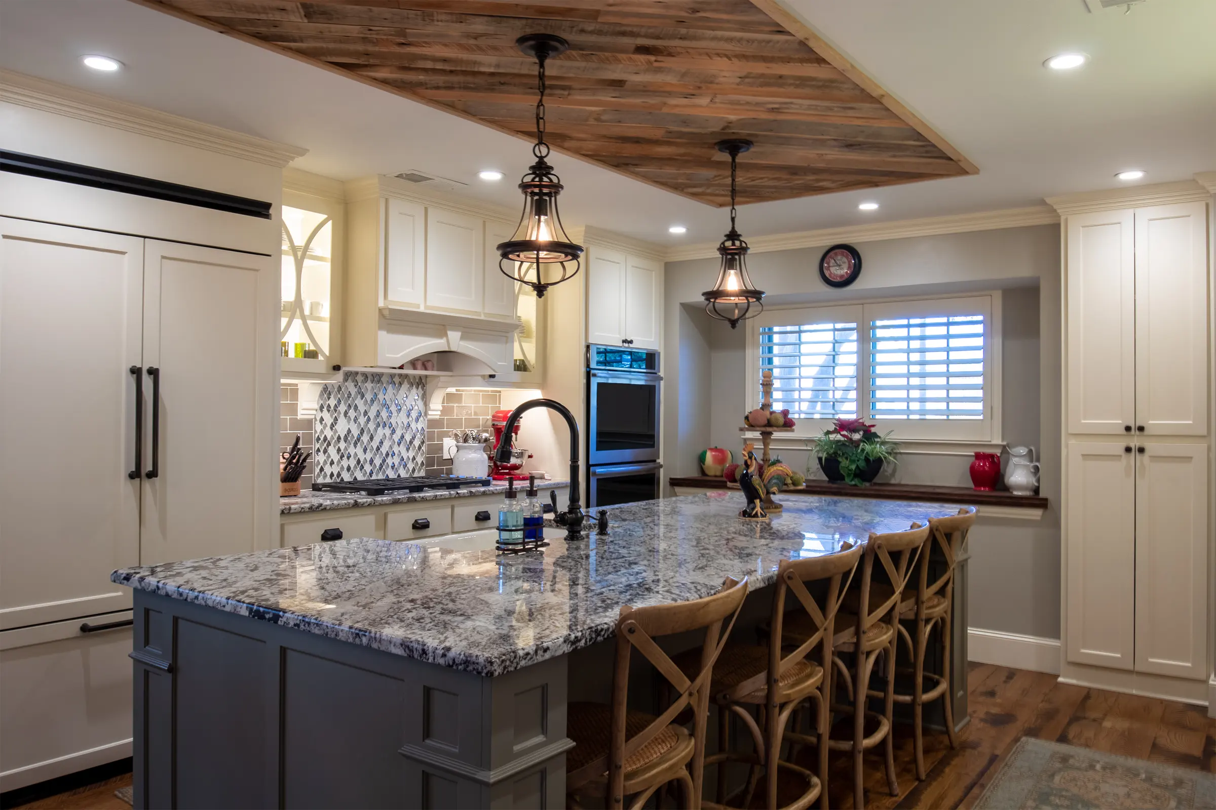 Blackwood kitchen with a stained plank ceiling and a granite island